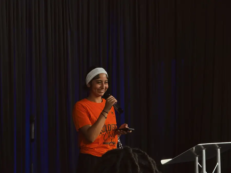 A speaker addressing the church with a microphone